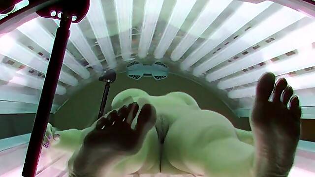 Sweet brunette in solarium