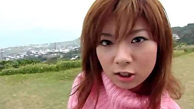 Soft pink turtleneck sweater on a fingered Japanese girl