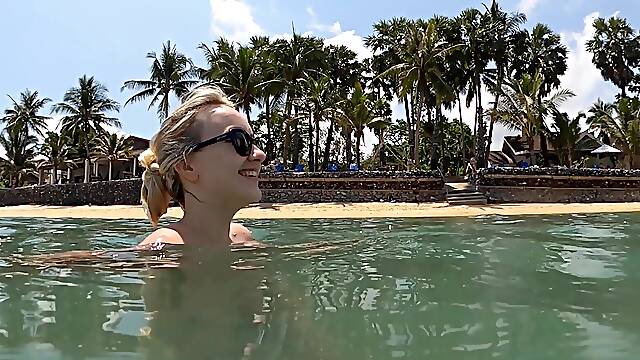 Lovita Fate shows off her slim body in a bikini by the pool